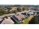 Rear view of house with screened patio and tropical landscaping at 17030 Se 79Th Clearview Ave, The Villages, FL 32162