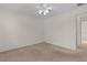 Spacious bedroom with ceiling fan, carpet, and neutral walls at 17030 Se 79Th Clearview Ave, The Villages, FL 32162