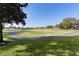 Landscaped golf course with walking path at 17030 Se 79Th Clearview Ave, The Villages, FL 32162