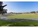 Golf course with trees and walking path at 17030 Se 79Th Clearview Ave, The Villages, FL 32162