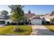 Single-story house with green lawn at 17030 Se 79Th Clearview Ave, The Villages, FL 32162