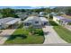 Mobile home with carport and palm tree landscaping at 1706 Pebble Beach Ln, Lady Lake, FL 32159