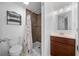 Neat bathroom with shower, toilet and vanity at 1706 Pebble Beach Ln, Lady Lake, FL 32159