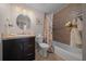 Clean bathroom with shower/tub combo, tile surround, and vanity at 1706 Pebble Beach Ln, Lady Lake, FL 32159