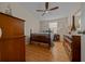 Cozy bedroom with wood flooring and antique furniture at 1706 Pebble Beach Ln, Lady Lake, FL 32159