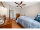 Bright bedroom featuring a comfortable bed and ample storage at 1706 Pebble Beach Ln, Lady Lake, FL 32159