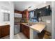 Small galley kitchen with microwave and mini-fridge at 1706 Pebble Beach Ln, Lady Lake, FL 32159