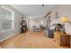 Living room with comfy seating, hardwood floors and TV stand at 1706 Pebble Beach Ln, Lady Lake, FL 32159