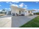 Spacious covered patio with seating and a storage area at 1706 Pebble Beach Ln, Lady Lake, FL 32159