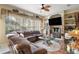 Relaxing living room featuring a sectional sofa and built-in shelving at 17430 Se 115Th Terrace Rd, Summerfield, FL 34491