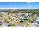 Aerial view of a single-Gathering home in a residential neighborhood at 1842 Captiva Ct, The Villages, FL 32162