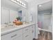 Double vanity bathroom with modern white cabinets and a shower at 1842 Captiva Ct, The Villages, FL 32162