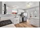 Modern kitchen with white cabinets, stainless steel appliances, and quartz countertops at 1842 Captiva Ct, The Villages, FL 32162