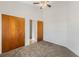 Bright bedroom with carpet flooring and double door closet at 2121 Croat St, Mount Dora, FL 32757