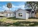 Gray house exterior with large windows and landscaping at 2121 Croat St, Mount Dora, FL 32757