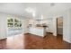 Kitchen with white cabinets, breakfast bar, and tile floor at 2121 Croat St, Mount Dora, FL 32757