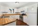 Galley kitchen with wood countertops and stainless steel appliances at 2121 Croat St, Mount Dora, FL 32757