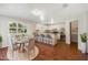 Virtually staged kitchen, features a breakfast bar and dining area at 2121 Croat St, Mount Dora, FL 32757