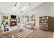 Virtually staged living room featuring a fireplace and comfortable furniture at 2121 Croat St, Mount Dora, FL 32757