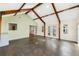 Sunroom addition with exposed beams and concrete floors at 2121 Croat St, Mount Dora, FL 32757