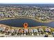 Aerial view showcasing home's lakefront location in a residential community at 2134 Zaragoza Pl, Lady Lake, FL 32159