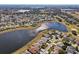 Aerial view of community with lake and golf course at 2134 Zaragoza Pl, Lady Lake, FL 32159