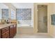 Bathroom features a soaking tub, double vanity, and glass shower at 2134 Zaragoza Pl, Lady Lake, FL 32159