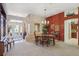 Bright dining room with a chandelier, wooden table, and view of entryway at 2134 Zaragoza Pl, Lady Lake, FL 32159