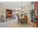 Formal dining room with a chandelier and wooden dining set at 2134 Zaragoza Pl, Lady Lake, FL 32159