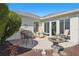 Relaxing patio with birdbath and seating area at 2134 Zaragoza Pl, Lady Lake, FL 32159