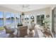 Sunroom with lake view and wicker furniture at 2134 Zaragoza Pl, Lady Lake, FL 32159