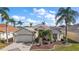 Beautiful one-story home with a landscaped yard and two-car garage at 2134 Zaragoza Pl, The Villages, FL 32159