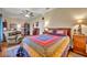 Spacious bedroom with a large bed and built-in shelving at 214 Forest Park Ln, Lady Lake, FL 32159