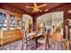 Elegant dining room with dark wood furniture and a large china cabinet at 214 Forest Park Ln, Lady Lake, FL 32159