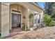 Brick walkway leading to a dark brown front door with sidelights at 214 Forest Park Ln, Lady Lake, FL 32159