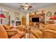 Living room with built-in shelving and a large TV at 214 Forest Park Ln, Lady Lake, FL 32159