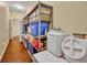 Organized storage room with shelving units and containers at 214 Forest Park Ln, Lady Lake, FL 32159