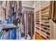 Large walk-in closet with custom shelving and hanging rods at 214 Forest Park Ln, Lady Lake, FL 32159