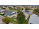 Aerial view of house and backyard, showcasing screened patio at 2240 Avon Loop, The Villages, FL 32162