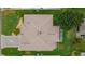 Aerial view of a single-Gathering home with a brown roof and landscaped yard at 2240 Avon Loop, The Villages, FL 32162