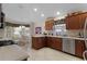 Spacious kitchen with stainless steel appliances and light wood cabinets at 2240 Avon Loop, The Villages, FL 32162