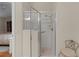 Walk-in shower with grab bars and a seat at 2240 Avon Loop, The Villages, FL 32162