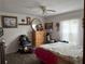 Bedroom with double bed and wood dresser at 225 N West St, Bushnell, FL 33513