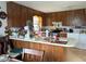 Kitchen with wood cabinets and an island at 225 N West St, Bushnell, FL 33513