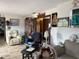 Living room with tiled floor and comfy seating at 225 N West St, Bushnell, FL 33513