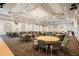 Large banquet hall with multiple tables and chairs at 2298 Caledonian St, Clermont, FL 34711