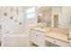 Bathroom with a large vanity and garden tub at 2298 Caledonian St, Clermont, FL 34711