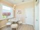 Breakfast nook with a round glass table and light-colored chairs at 2298 Caledonian St, Clermont, FL 34711