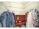 Walk-in closet with shelves and hanging rods at 2298 Caledonian St, Clermont, FL 34711