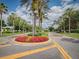 Palm-lined entrance to the community with a circular drive at 2298 Caledonian St, Clermont, FL 34711